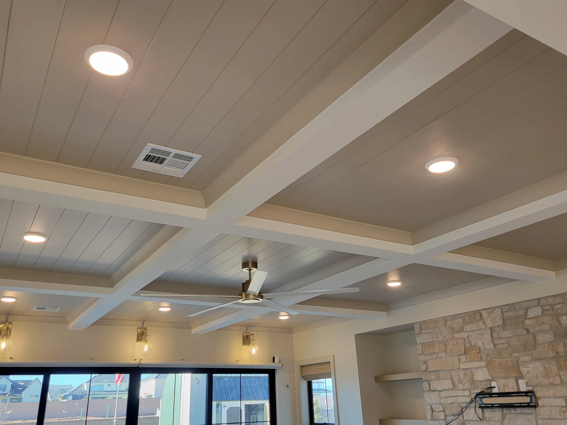 Interior ceiling with painted beams and recessed lighting